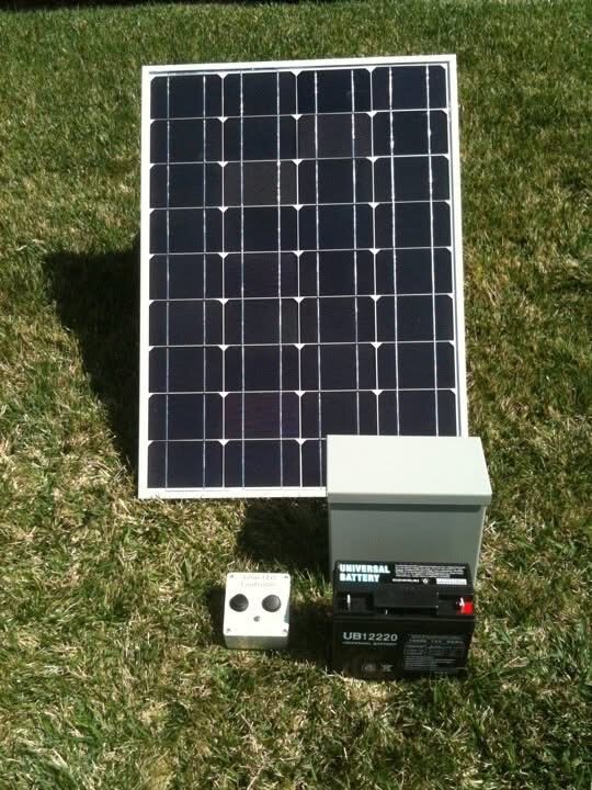Solar fountain controller panel and waterproof box on grass