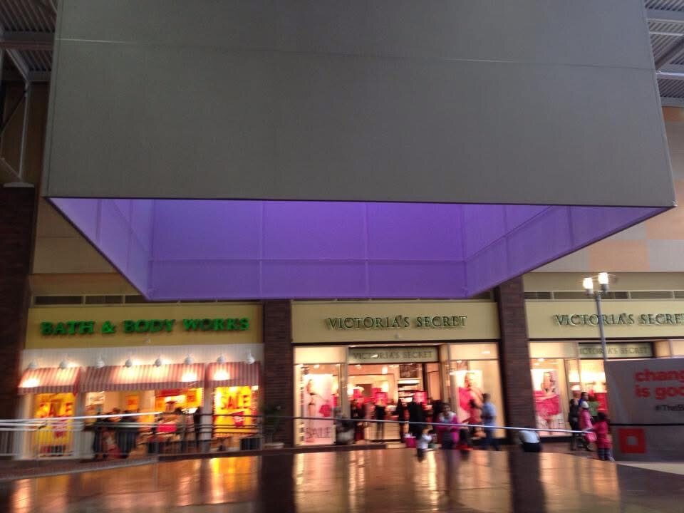 The Bloc cube lit purple at night
